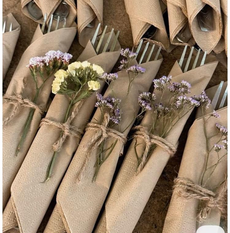 Hand-wrapped place settings with dried florals